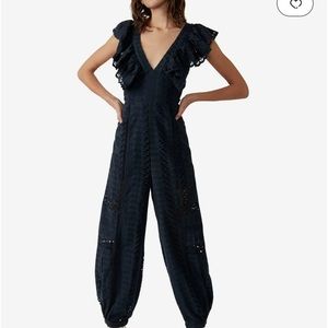 NWT.  Free People Mikayla Jumpsuit, navy blue, size medium.
